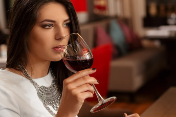 Young woman waiting for her date at the restaurant