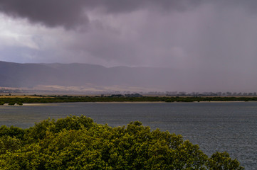 Storm front moving over Port Pirie bay bringing rain and rainbows to the Flinders Ranges