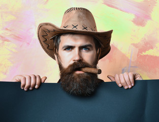 Bearded brutal caucasian hipster cowboy