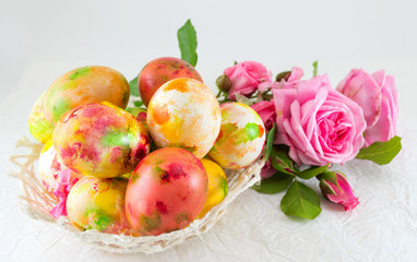 Easter eggs and pink roses bouquet