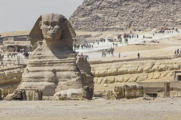 Closeup view of the Sphinx head with pyramid in Giza near Cairo, Egypt