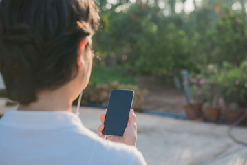 Closeup  phone use telephone in right hand women . Lifestyle for people.