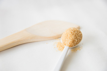 Brown sugar on white background.