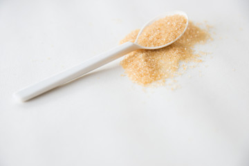 Brown sugar on white background.