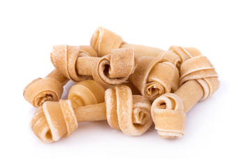 Artificial a bone for a dog with vitamins on white background