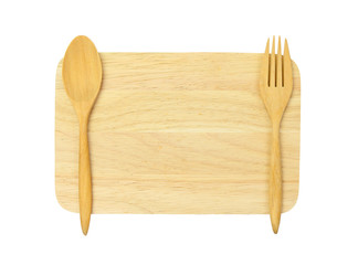 wooden spoon and fork on wooden board against white background