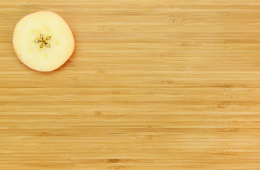 Apple cut on a wooden board