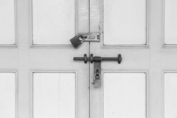 old lock and Rusty padlock on an old wooden door with vintage style, Black and white