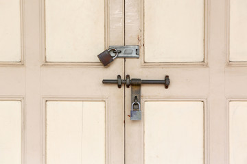 old lock and Rusty padlock on an old wooden door with vintage style