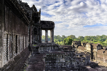 Naklejka premium Angkor Wat terrace. This is a temple complex in Cambodia and the largest religious monument in the world originally constructed as a Hindu temple. It is the country's prime attraction for visitors