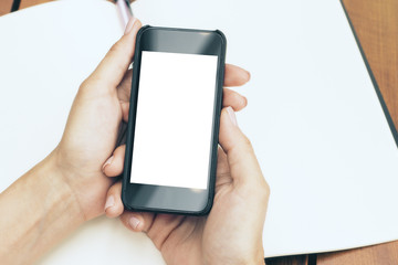 Woman holding cellphone top
