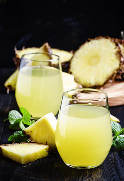 Pineapple juice, dark background, selective focus