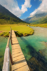 Footbridge over the Chiese river and in the National Park of Adamello Brenta from the Val di Fumo. Trentino Alto Adige, Italy