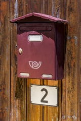 mailbox on a wooden fence