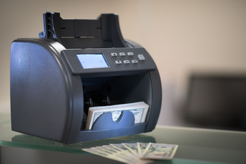 Banknote counter with money