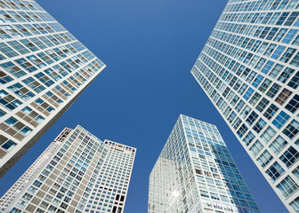 Obraz na płótnie Canvas Group of skyscrapers against a blue sky