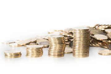 Coin stack near a pile of another golden coins