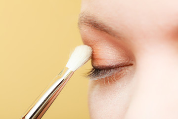 Close up woman getting make up, eyeshadow - obrazy, fototapety, plakaty