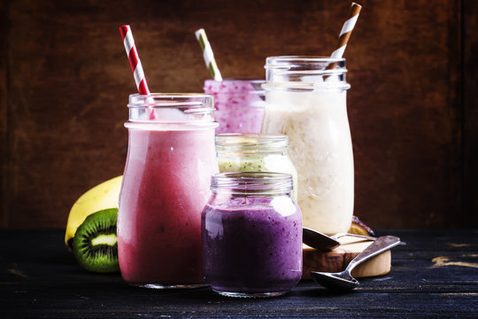 Selection of colorful berry and fruit smoothies and milkshakes, selective focus