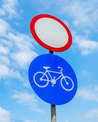 road signs against the sky, transportation is closed and cyclists