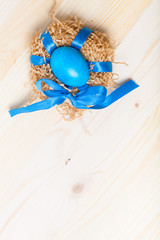 Easter composition on light wooden background