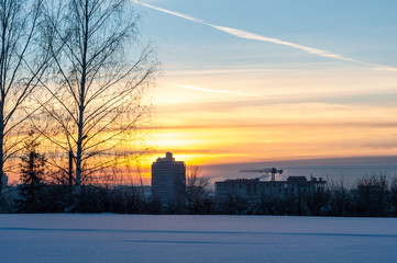 Winter view of the city and the house under construction.