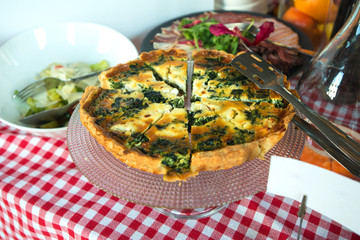 Traditional greek spinach pie, spanakopita, with goat cheese. Brunch in a restaurant