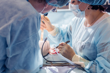 breast augmentation surgery in the operating room surgeon tools implant