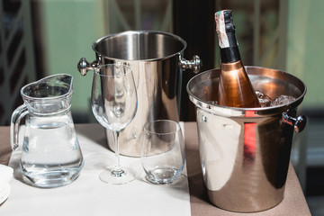 Bottle of champagne in bucket in a restaurant