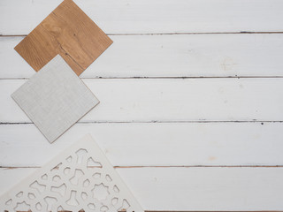 samples of material, wood , color, on wooden table.Interior design select material for idea.