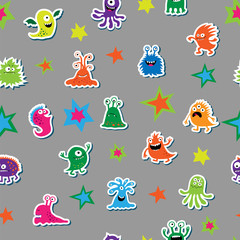 Seamless texture with cartoon monsters on a gray background