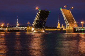 Fototapeta na wymiar Beautiful view of the breeding of bridges in the night St. Petersburg from the embankment of the Neva River