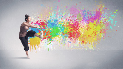 Fototapeta na wymiar Young colorful street dancer with paint splash