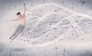 Performance ballet dancer jumping with energy explosion particles