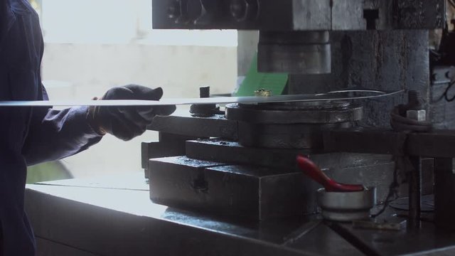CU Workers using metal shaping press at the factory. 4K UHD 