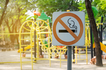 no smoking metal sign in the park.