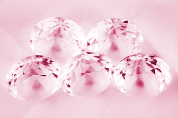 Obraz na płótnie Canvas Diamond / View of diamond on canvas background. Pink tone. Shallow depth of field.