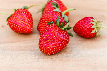 red close up strawberries with selective focus on a strawberry with many strawberries