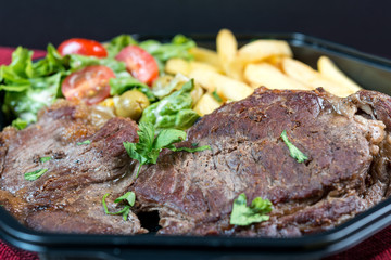 juicy steak beef meat with tomato and french fries