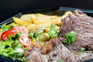 juicy steak beef meat with tomato and french fries