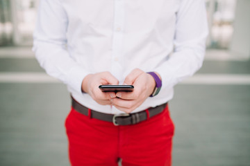 Man using a smartphone. Modern digital concept. Close-up corporate smartphone approach.