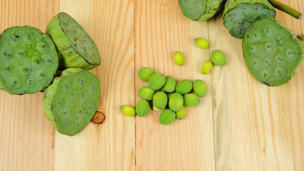 Lotus seed green on wooden background