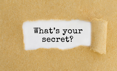 What's your secret appearing behind ripped brown paper.