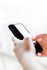 Woman using mobile smartphone. Modern or business concept. Close-up corporate smartphone approach.