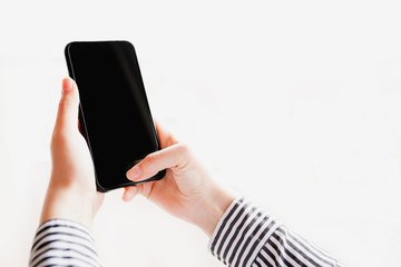 Woman using mobile smartphone. Modern or business concept. Close-up corporate smartphone approach.