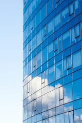 Modern office building, with a clean view of the sky. Economic and financial concept. Facade glass building background and sky view.