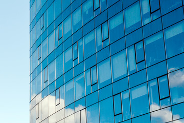 Fototapeta na wymiar Modern office building, with a clean view of the sky. Economic and financial concept. Facade glass building background and sky view.