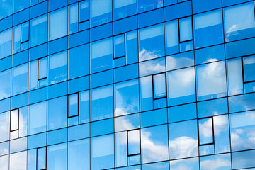 Obraz na płótnie Canvas Office building windows. Corporate and banking background concept. Modern building, with structural lines.