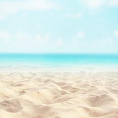 Fototapeta na wymiar Sand beach tropical with blurred sea sky and sunny background, summer day, copy space or for product.