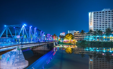 colorful light on Ping River at Iron bridge in Chiang mai, Thailand